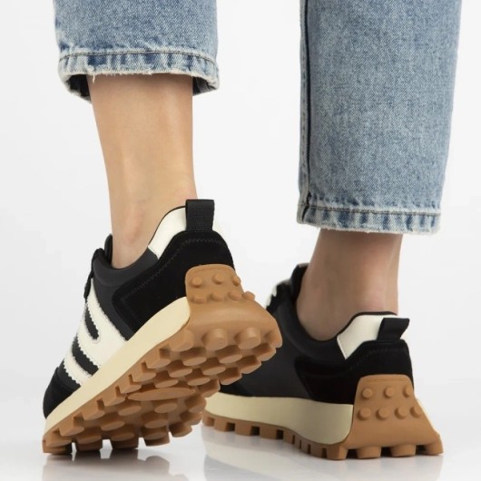 Skórzane sneakersy damskie Filippo – czarne buty sportowe na platformie